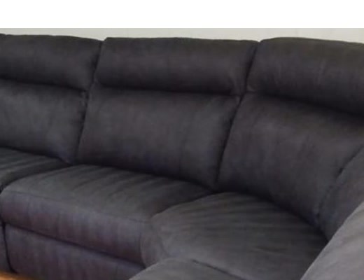 The same gray reclining sectional sofa after upholstery cleaning, the stain gone
